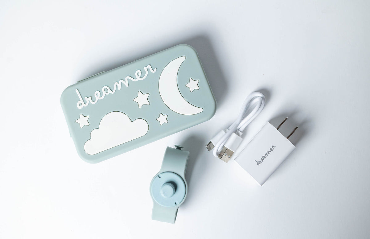 Dreamer™ baby sound machine kit in light blue with silicone case, magnetic strap, and USB-C cable