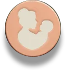 Silhouette of mother holding baby on a soft peach round background icon