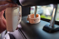 Load image into Gallery viewer, Dreamer baby sound machine being attached to magnetic mount on car headrest (Peach-Dreamer)
