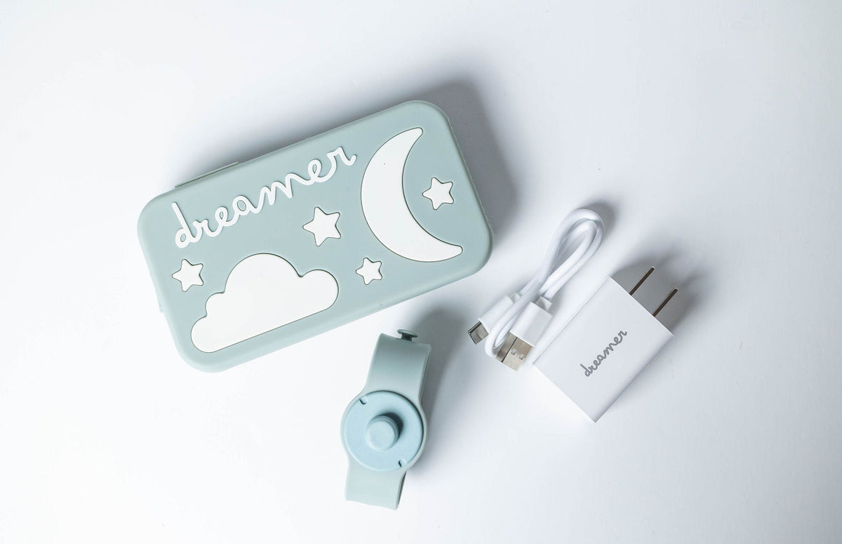 Dreamer™ baby sound machine kit in sage green with silicone case, magnetic strap, and USB-C cable