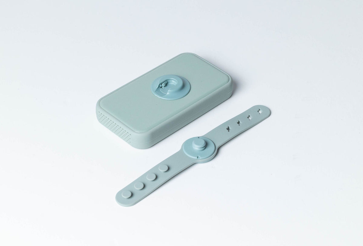 Dreamer™ baby sound machine in sage green with adjustable silicone magnetic strap
